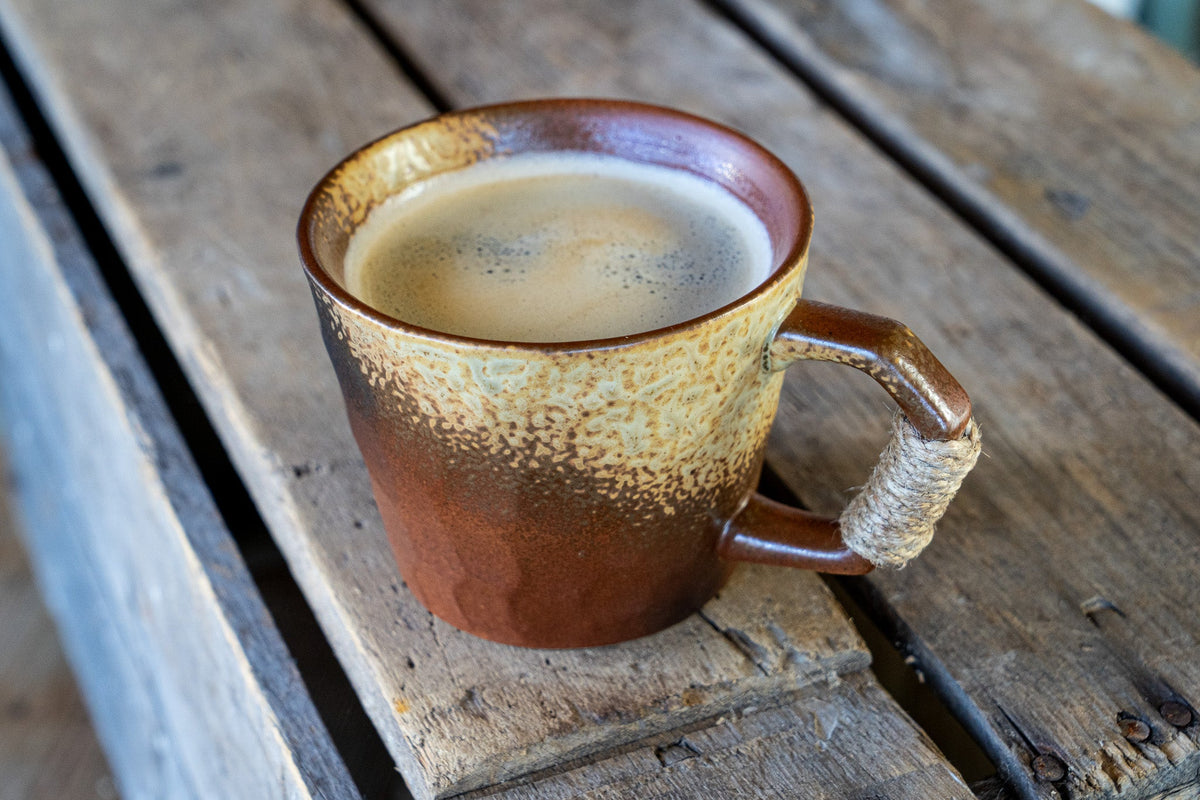 Rustic Handmade Ceramic Coffee Mug – Textured Stoneware with Earthy Glaze & Wrapped Handle